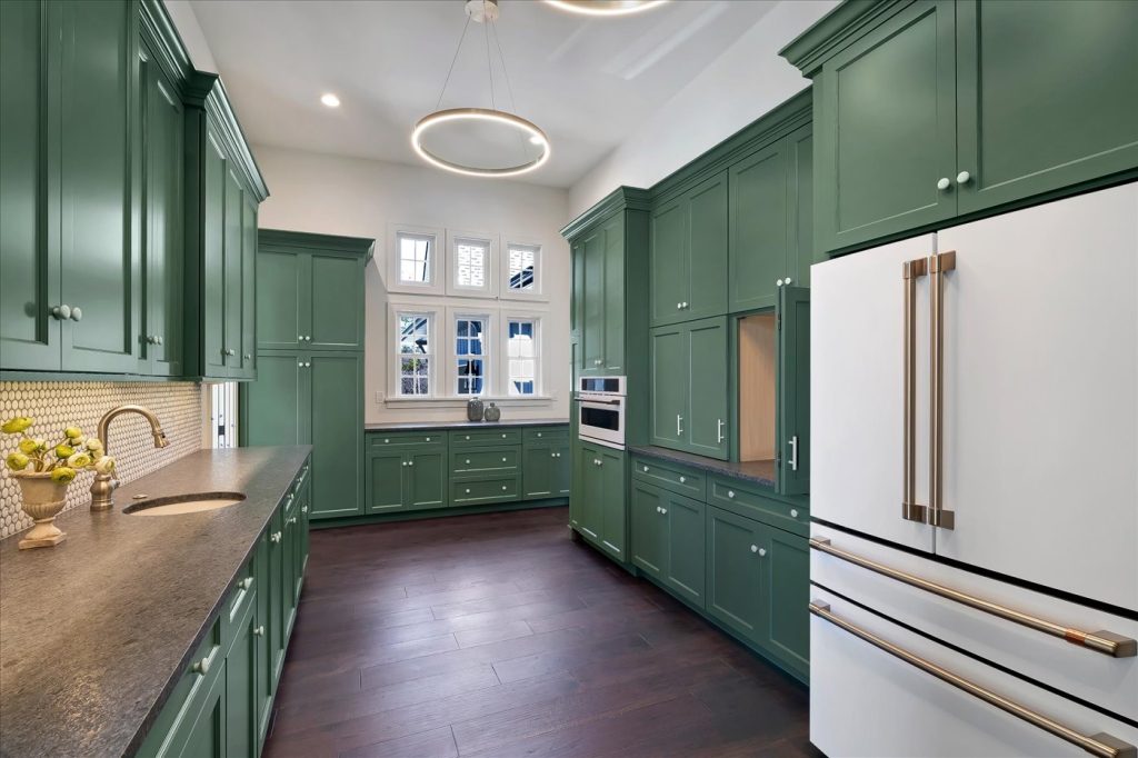 Stockell Custom Homes photo of butler's pantry appliances, cabinetry, lighting fixtures, and countertops