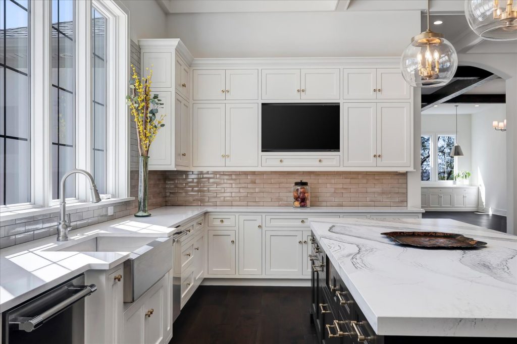 Stockell Custom Homes photo of kitchen cabinetry, appliances, and electronics