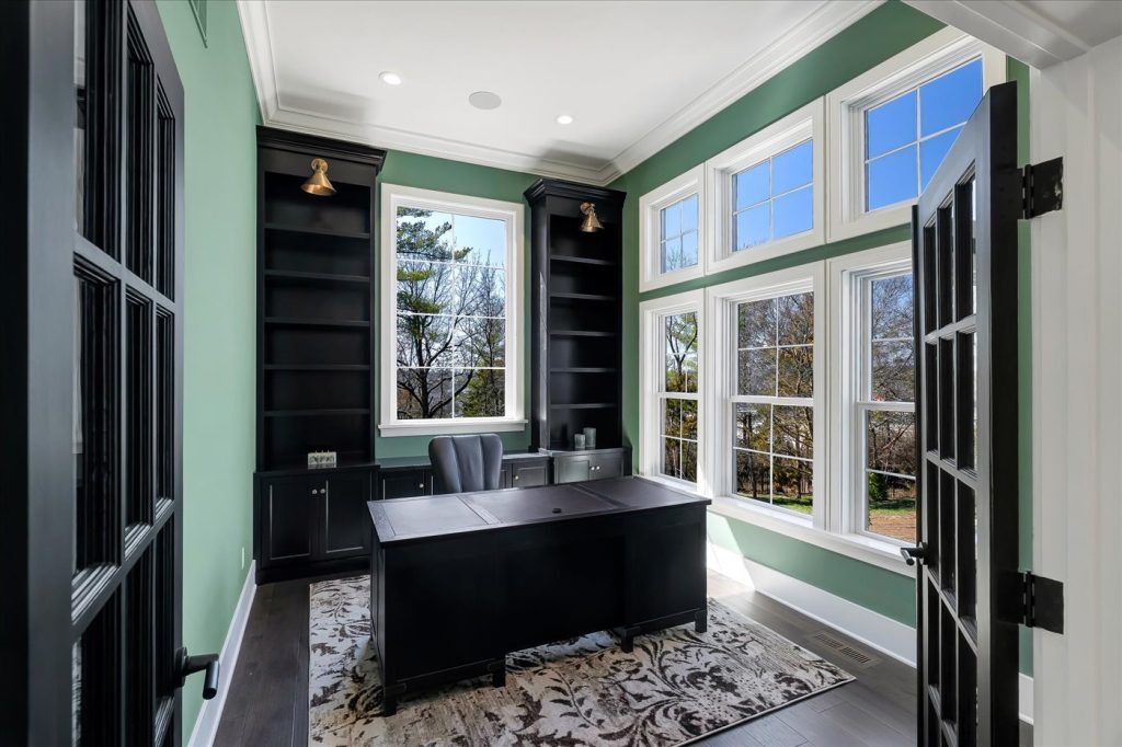Stockell Custom Homes photo of custom home office desk, shelving, and windows