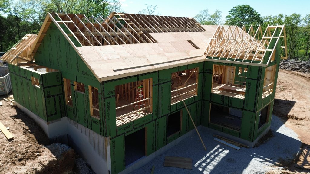 Stockell Custom Homes photo of roof framing and sheeting