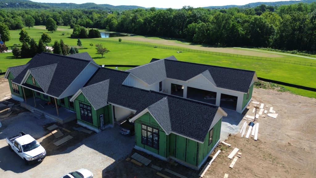 Stockell Custom Homes photo of roofing finish & siding progress on new custom home