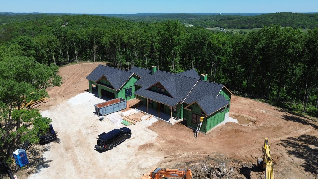Stockell Custom Homes aerial photo of finished roof on rural custom home