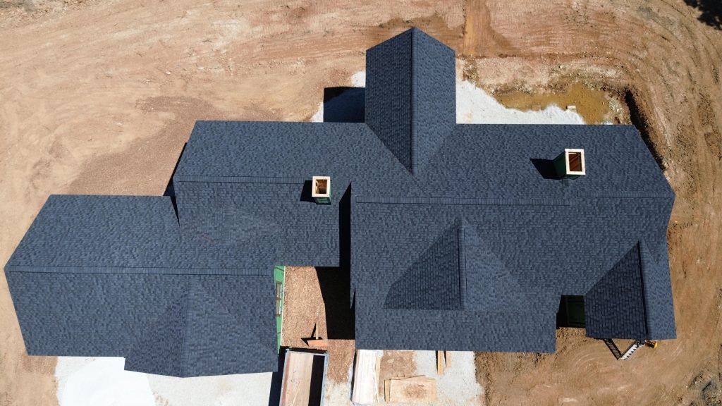 Stockell Custom Homes aerial photo of finished roof on in-progress rural custom home